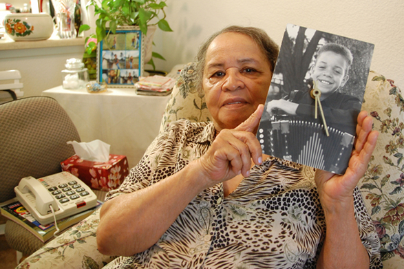 Lena Pitre, holding a picture of her grandson, Andre Thierry.